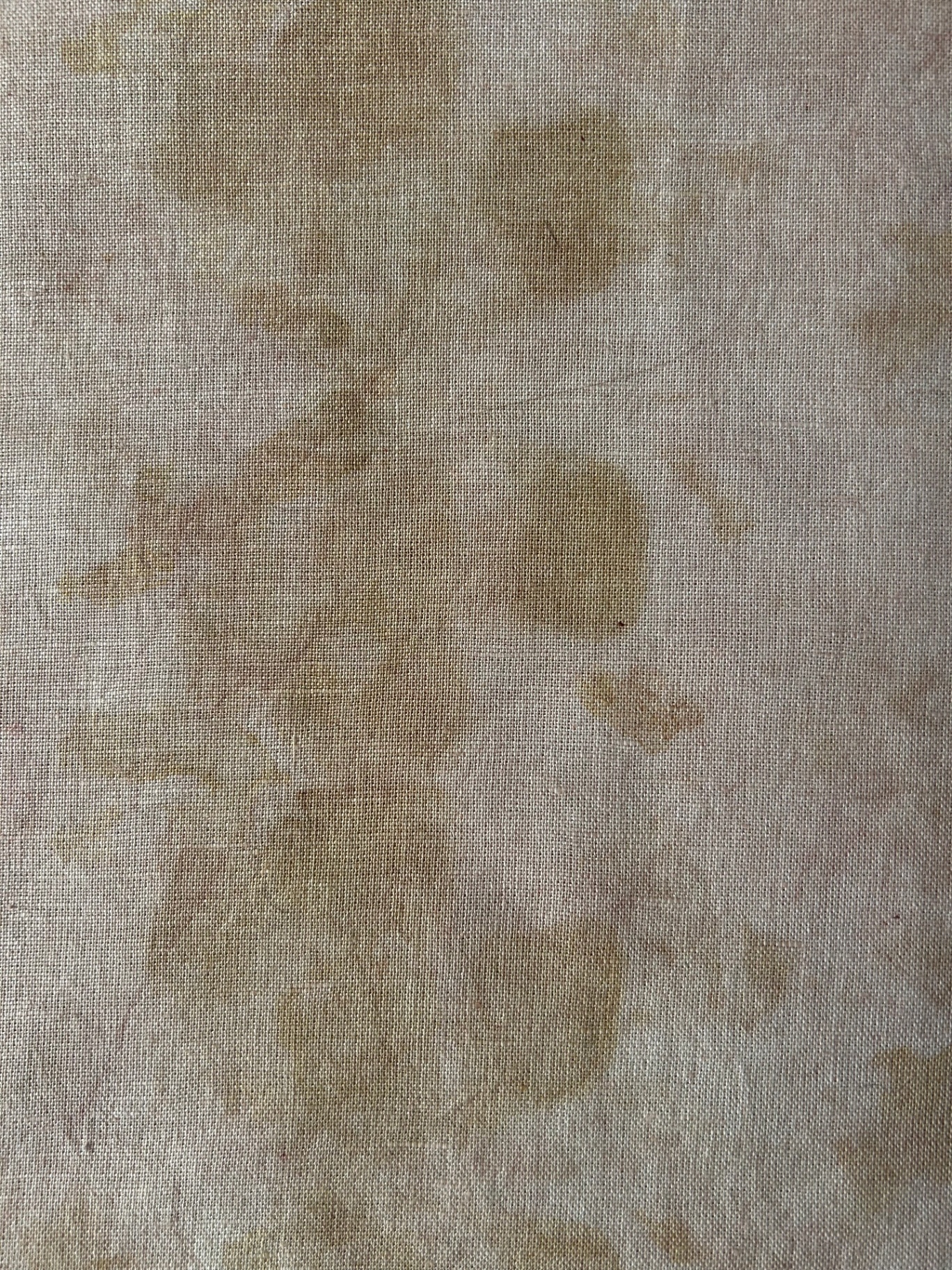 Naturally dyed ochre linen, hand-mended with visible stitching