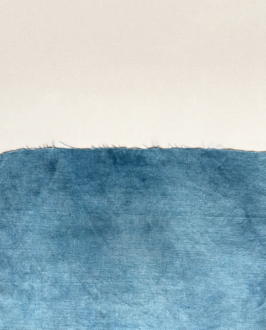 Water Borders — a composition of cream paper and blue linen